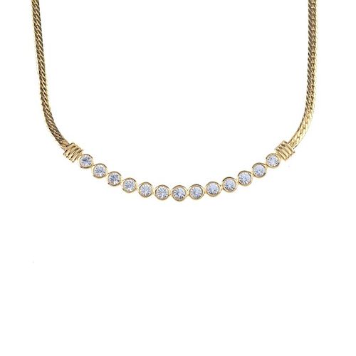 SWAROVSKI - a necklace. Designed as a flat curb-link chain to the thirteen collet-set colourless pas