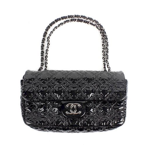CHANEL - a black patent shoulder bag. Of rectangular shape with abstract floral and CC pattern, a si