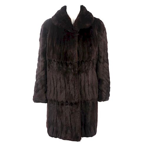 Two knee-length fur coats. To include a dyed ermine coat, designed with a lapel collar and hook and