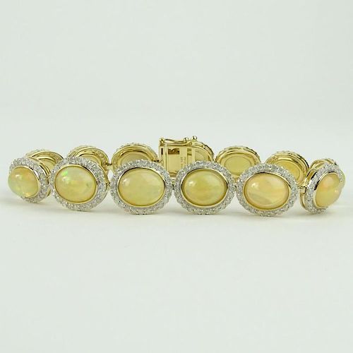 AIG Certified 18.43 Carat Cabochon Opal, 3.25 carat Round Cut Diamond and 14 Karat Yellow Gold Bracelet.
