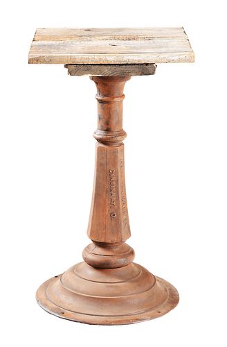 CAST IRON SLOT MACHINE STAND WITH ADDED WOODEN TOP.