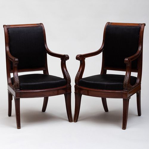 Pair of Continental Neoclassical Carved Mahogany and Horsehair Upholstered Armchairs