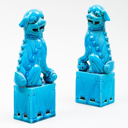 Pair of Chinese Turquoise Glazed Porcelain Figures of Buddhistic Lions 