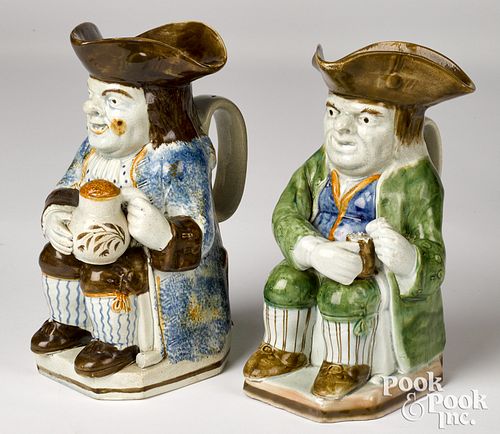 Two Staffordshire toby pitchers, ca. 1800