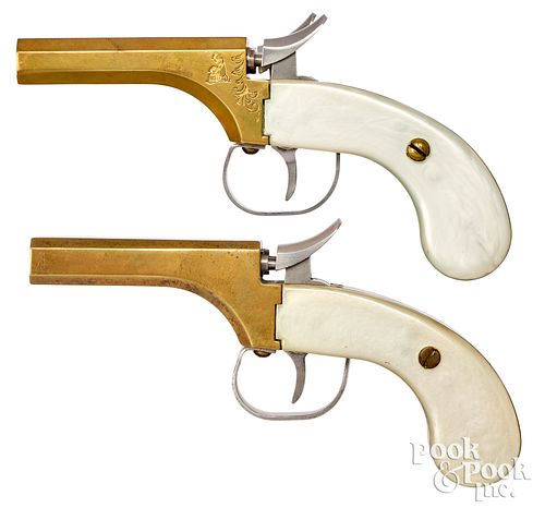 Two Classic Arms Intl. double barrel pistols