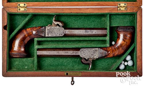 Cased pair of engraved European percussion pistols