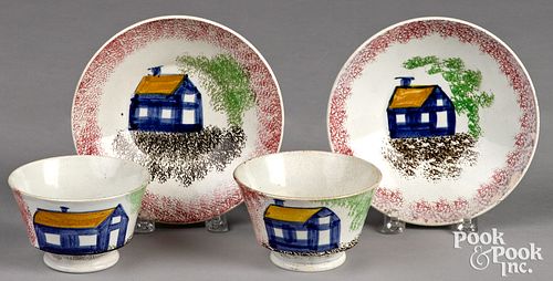 Pair of red spatter cups and saucers