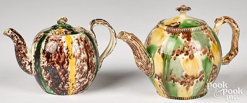 Two Staffordshire tortoiseshell glaze teapots
