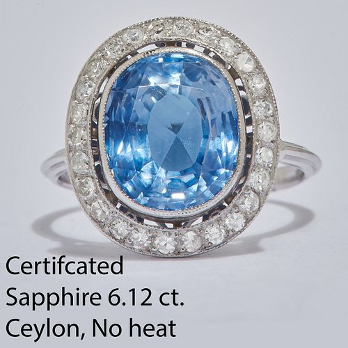 IMPORTANT 6.12 CT. CEYLON BLUE SAPPHIRE AND DIAMOND CLUSTER RING