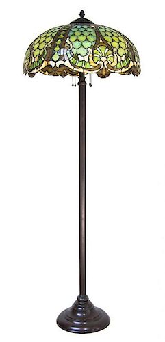 A Williamson Leaded Glass Floor Lamp, Height overall 62 1/2 x diameter of shade 22 inches.