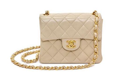 A Chanel Cream Calfskin Leather Small Flap Handbag, 6.5" x 5.5" x 2.5".