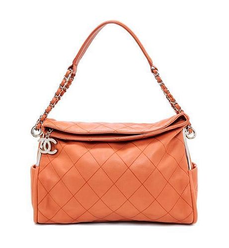 A Chanel Coral Calfskin Leather Quilted Fold Over Handbag, 12.5" x 11" x 4.5".