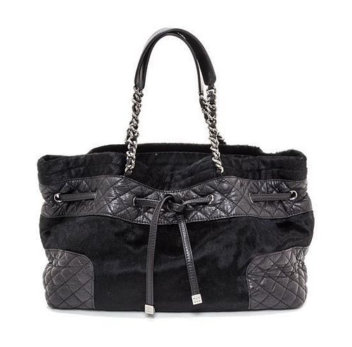 A Chanel Black Pony Hair Drawstring Tote Bag, 14" x 9" x 5".