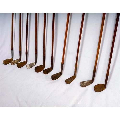 Set of Ten Iron Golf Clubs with Wood Shafts