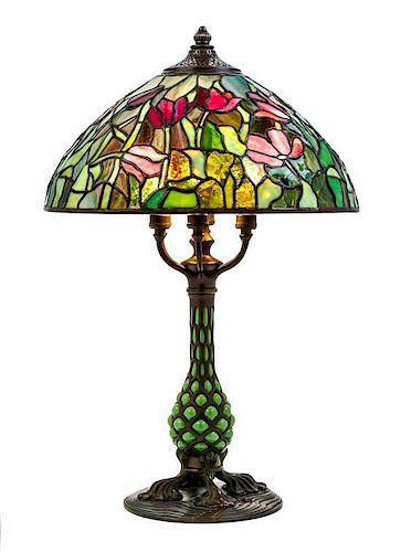 A Tiffany Studios Favrile Glass And Bronze Blown-Out Glass Tulip Lamp, Height overall 24 1/4 x diameter of shade 16 inches.