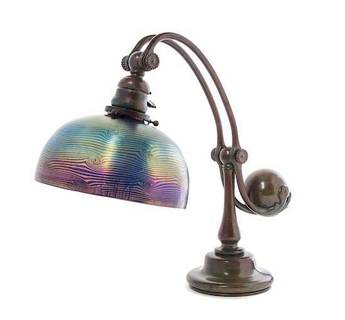 A Tiffany Studios Blue Favrile Glass and Bronze Counterbalance Lamp, Height of base 14 1/4 x diameter of shade 8 inches.