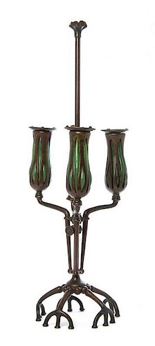 A Tiffany Studios Bronze and Blown-Out Glass Three-Light Adjustable Candelabra, Height 20 3/8 inches.