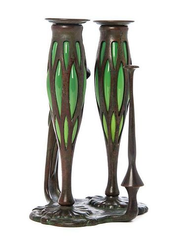 A Tiffany Studios Bronze and Blown-Out Glass Two-Light Chamber Stick, Height 9 1/4 inches.