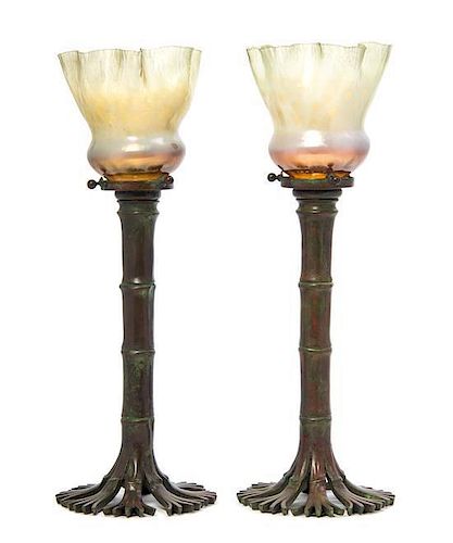 A Pair of Tiffany Studios Bronze Candlesticks, Height 14 5/8 inches.