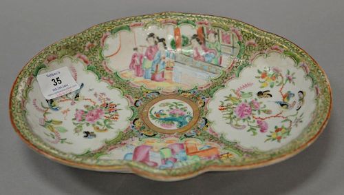 Famille Rose shaped deep dish with four panels, late 19th century. 
ht. 1 1/2 in.; lg. 10 3/4 in.; wd. 8 1/2 in.