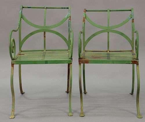 Set of eight French iron outdoor armchairs.