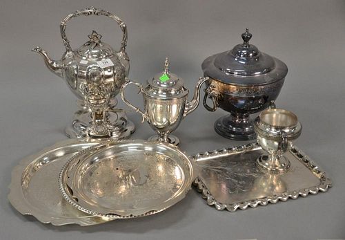 Eight piece silverplate lot with covered tureen, tilting pot on stand, four trays, teapot, and sugar. tureen: ht. 12 in., largest tu...