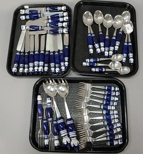 Set of Rosenthal Grill blue stainless with porcelain handled flatware set, 48 total pieces.