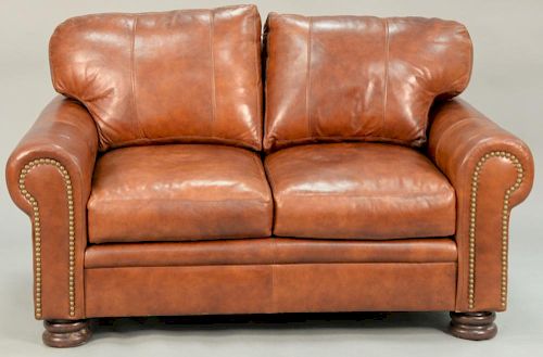 Braddington three piece leather set including two loveseats and an ottoman. loveseats: lg. 60 in.