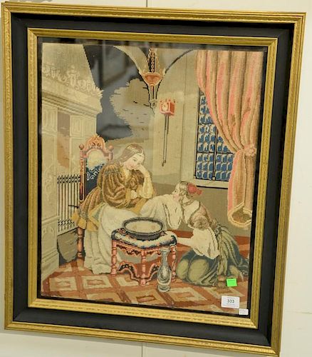 Framed needlepoint Victorian interior scene of a woman and her maid. 23 1/2" x 19".