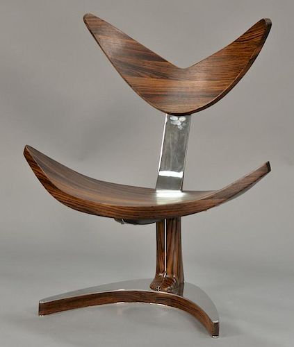 Rosewood and polished stainless steel free form chair with floating seat and "V" shaped back, by Bruno Helgen. ht. 38 in.; wd. 33 in.