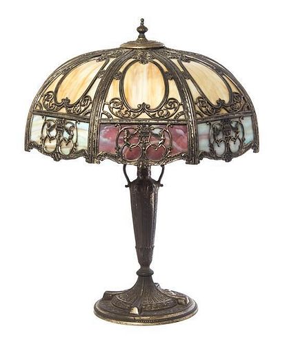 A Silvered Metal and Slag Glass Table Lamp, Height overall 22 1/4 x diameter of shade 20 1/2 inches.