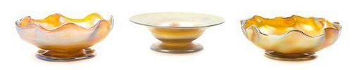 Three Tiffany Studios Gold Favrile Glass Footed Bowls, Diameter of largest 6 inches.