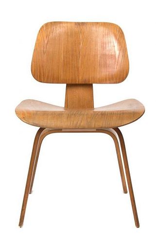 * A Charles and Ray Eames Bentwood DCW Chair, Height 27 inches.