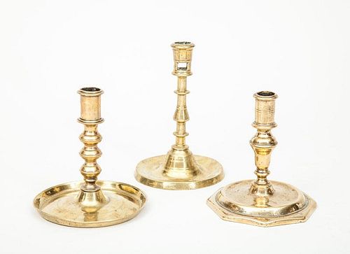 French Baroque Bell Metal Candlestick, a Flemish Brass Candlestick, and a Spanish Brass Stick