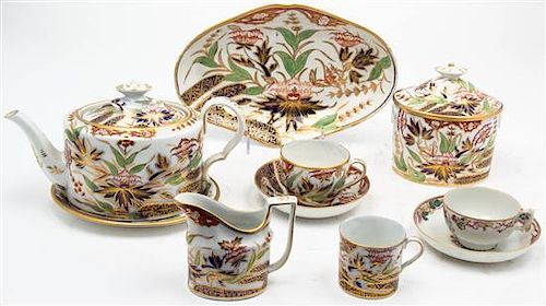 * An Assembled English Porcelain Tea Set, Width of first over handle 10 1/4 inches.