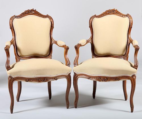 Pair of Louis XV Style Carved Walnut Fauteuils en Cabriolet