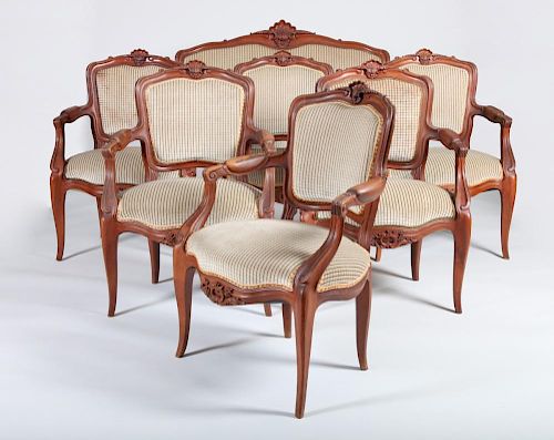 Set of Six Louis XV Style Carved Walnut Fauteuils en Cabriolet and a Matching Settee