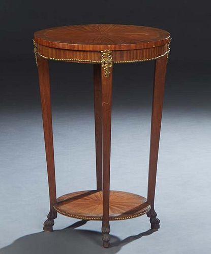 French Louis XVI Style Inlaid Carved Cherry Ormolu Mounted Gueridon, 20th c., the crotched circular top over a skirt with ormolu beading, on tapered s