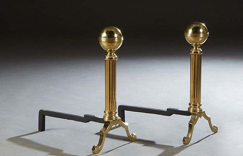 Pair of Brass and Iron Andirons, 20th c., with brass ball tops on reeded tapering brass supports, to iron log holders, H.- 18 in., W.- 10 in., D.- 17 