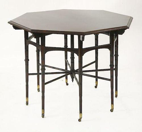 A rosewood octagonal table,<BR>designed by E W Godwin (1833-1886) by Collinson & Lock, on turned tap