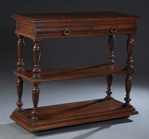 French Henri II Style Carved Oak Serving Trolley, c. 1880, the stepped lifting top with a folding shelf, over an inset white marble top, over two frie