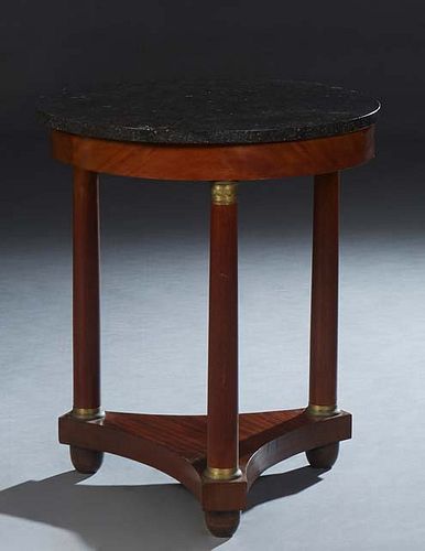 French Empire Style Ormolu Mounted Carved Walnut Marble Top Gueridon, 19th c., the figured circular marble over a wide skirt, on ormolu mounted tapere