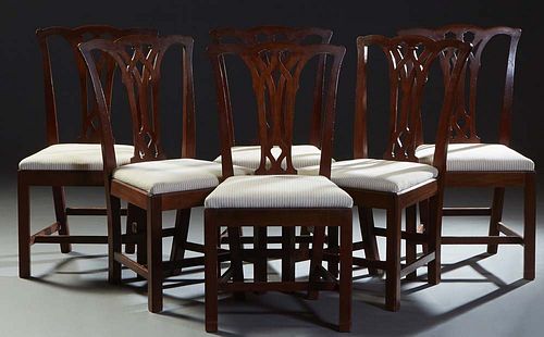Set of Six Chippendale Style Carved Mahogany Side Chairs, 20th c., the serpentine crest rail over a pierced intertwined vertical splats to trapezoidal
