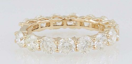 Lady's 18K Yellow Gold Eternity Ring, mounted with 15 prong set round white diamonds, total diamond wt.- 3.68 cts., Size 7, with appraisal.