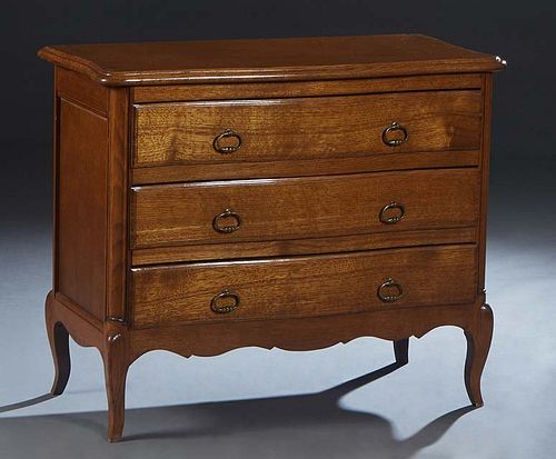 French Provincial Carved Oak Louis XV Style Commode, 20th c., the bowed stepped rounded corner and edge top over three bowed drawers, on cabriole legs