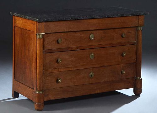 French Empire Style Ormolu Mounted Carved Walnut Marble Top Commode, mid 19th c., the figured black marble over a frieze drawer and three deep drawers