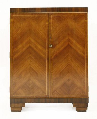 An Art Deco walnut and rosewood bar,<BR>the top hinged and opening to reveal a mirror, over shelves