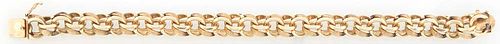 14K Yellow Gold Double Link Bracelet, one link with a Florentine finish, the other smooth, L.- 8 1/4 in., Wt.- 1.59 Troy Oz. Provenance: The Estate of