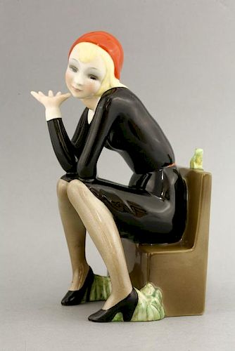 A Lenci figure,<BR>'Nella', modelled by Helen Koenig Scavini, modelled as a girl seated on a bench b