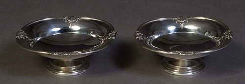 Pair of Elkington Sterling Candy Dishes, Birmingham, 1938, #28979, the oval pierced rim with relief floral garland decoration, on a stepped footed bas